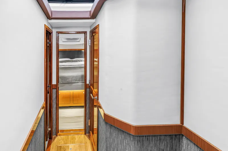 Slide: The Image of Interior hallway of 2016 Sea Ray 510 Fly yacht, featuring wood accents and modern design. - 24