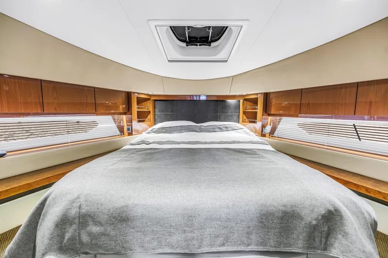 Slide: The Image of Luxurious bedroom interior of 2016 Sea Ray 510 Fly yacht with elegant wood finishes. - 26