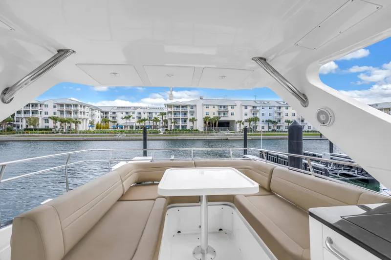 Slide: The Image of Luxurious 2016 Sea Ray 510 Fly yacht with spacious seating and waterfront view. - 34