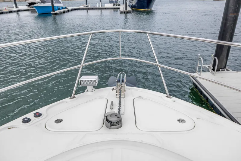 Slide: The Image of Bow view of 2016 Sea Ray 510 Fly yacht docked at marina. - 49