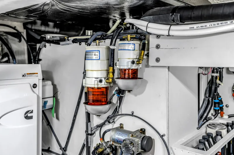 Slide: The Image of Engine room of 2016 Sea Ray 510 Fly with fuel filters and wiring. - 58