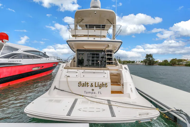 Slide: The Image of 2016 Sea Ray 510 Fly yacht docked in Tampa, Florida, with clear blue skies. - 8