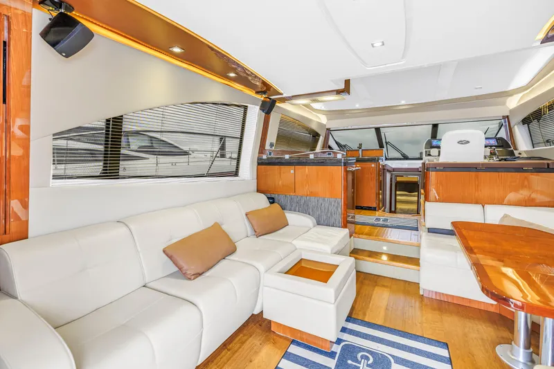 Slide: The Image of Luxurious interior of 2016 Sea Ray 510 Fly yacht with plush seating and modern design. - 12