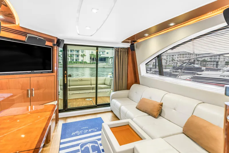 Slide: The Image of Luxurious interior of 2016 Sea Ray 510 Fly yacht with plush seating and waterfront view. - 15