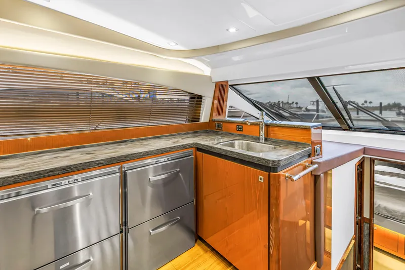Slide: The Image of Luxurious kitchen interior of 2016 Sea Ray 510 Fly yacht with modern appliances. - 16