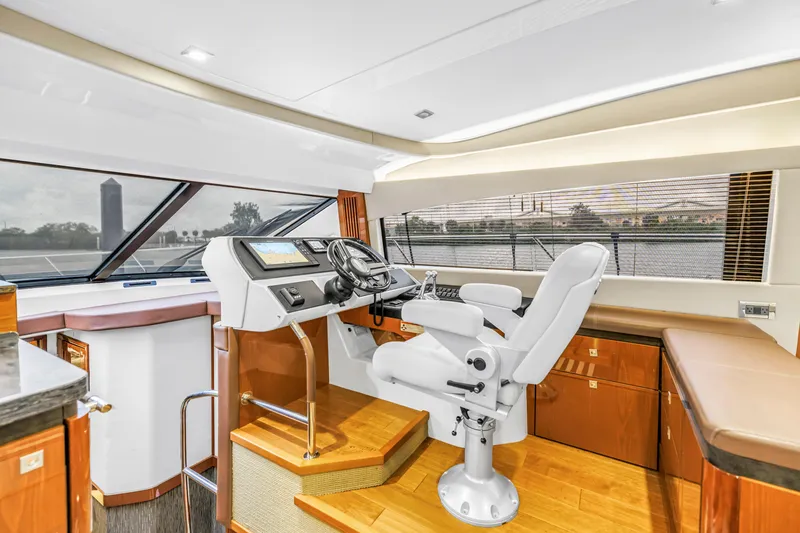 Slide: The Image of Luxurious helm station of 2016 Sea Ray 510 Fly yacht with panoramic windows. - 21