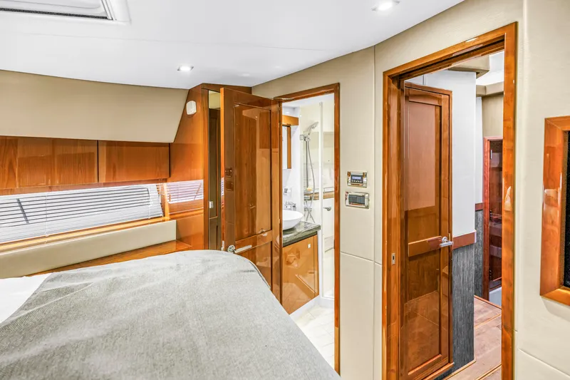 Slide: The Image of Luxurious interior of 2016 Sea Ray 510 Fly yacht with wood finishes and modern amenities. - 28