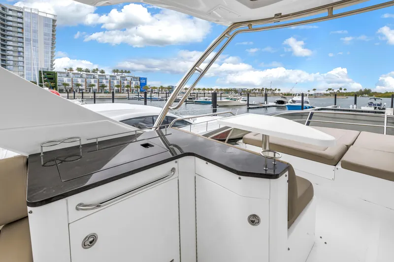 Slide: The Image of Luxurious 2016 Sea Ray 510 Fly yacht interior with marina view and modern amenities. - 37