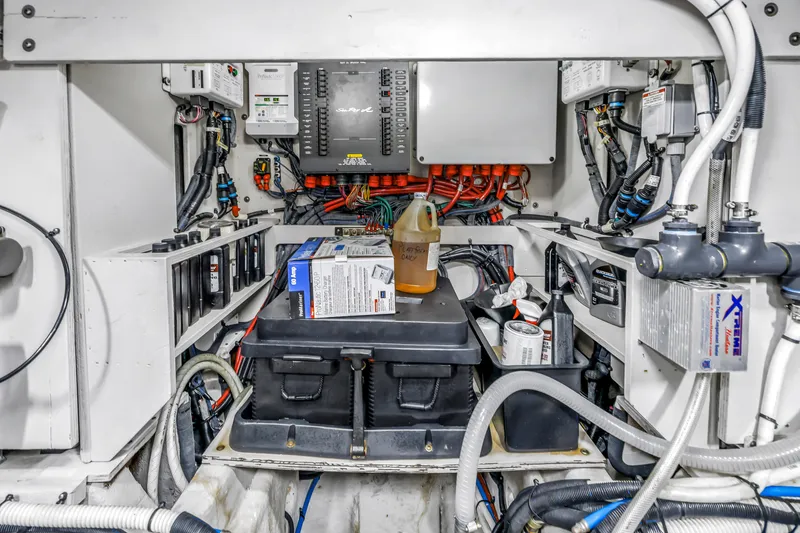 Slide: The Image of Engine room of 2016 Sea Ray 510 Fly yacht with wiring and maintenance supplies. - 52