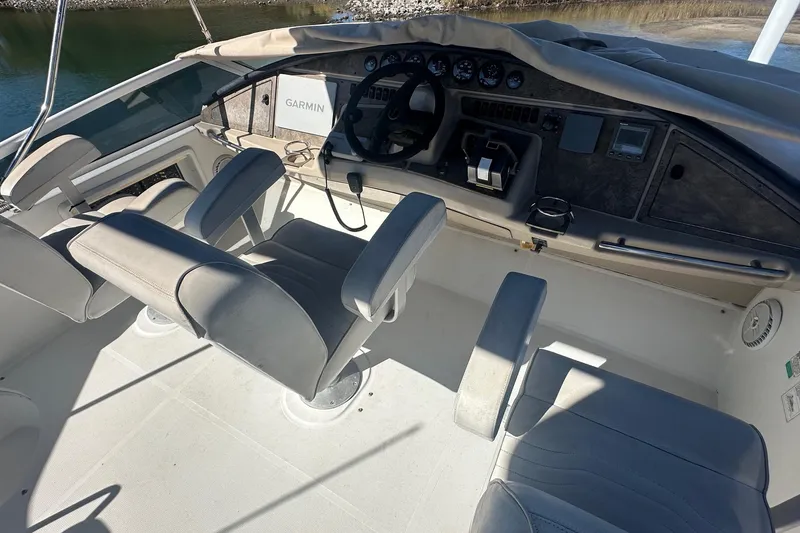 Slide: The Image of 2005 Carver 360 Sport Sedan cockpit with Garmin navigation system and dual seating. - 10