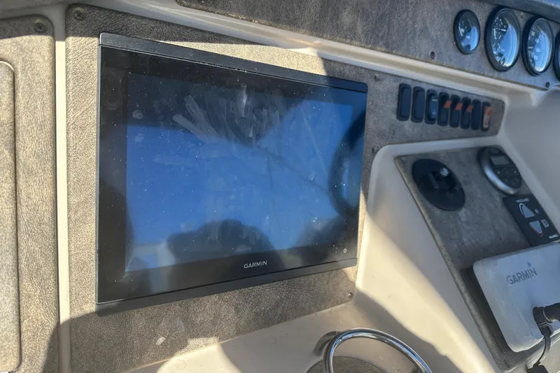 Slide: The Image of Dashboard of a 2005 Carver 360 Sport Sedan with Garmin navigation display. - 12