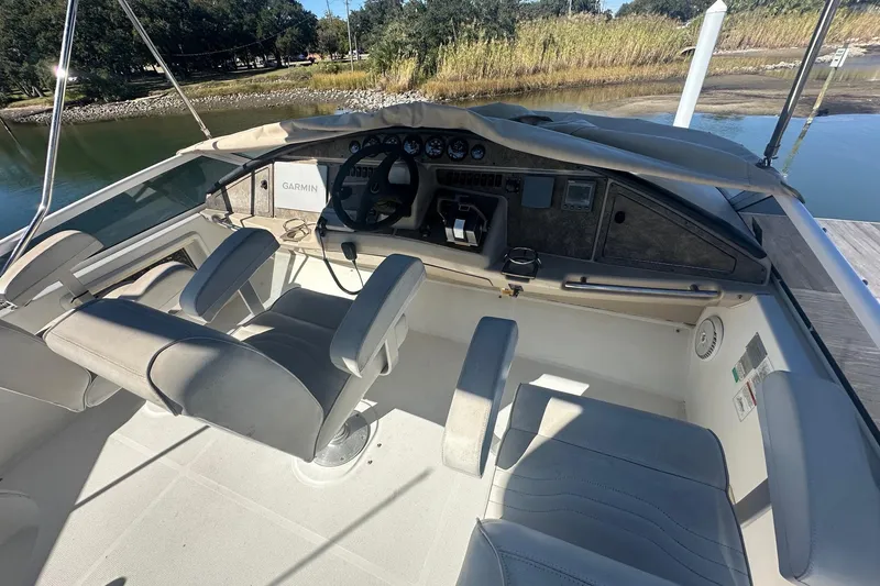 Slide: The Image of 2005 Carver 360 Sport Sedan cockpit with dual seats and Garmin navigation system. - 17