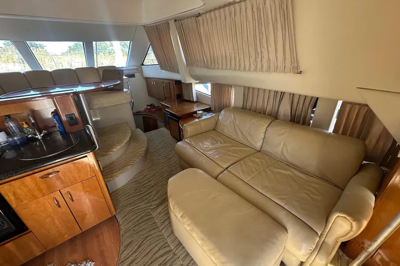 Slide: The Image of Luxurious interior of a 2005 Carver 360 Sport Sedan with leather seating and wood cabinetry. - 3