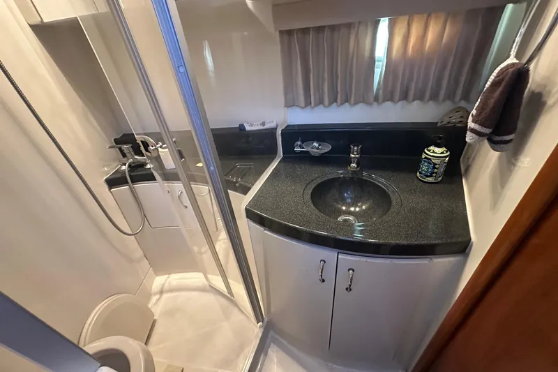 Slide: The Image of Bathroom interior of 2005 Carver 360 Sport Sedan with shower and sink. - 7