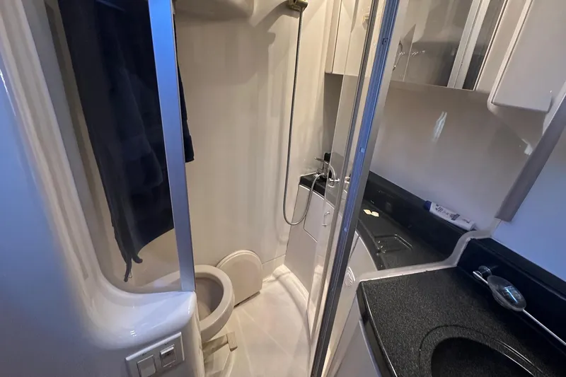 Slide: The Image of 2005 Carver 360 Sport Sedan bathroom with shower, toilet, and sink. - 8