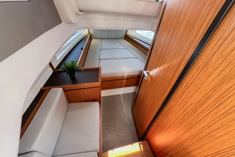 Slide: The Image of 2025 Aiata Wayfinder 38 Cabin interior with modern wood finish and seating area. - 28