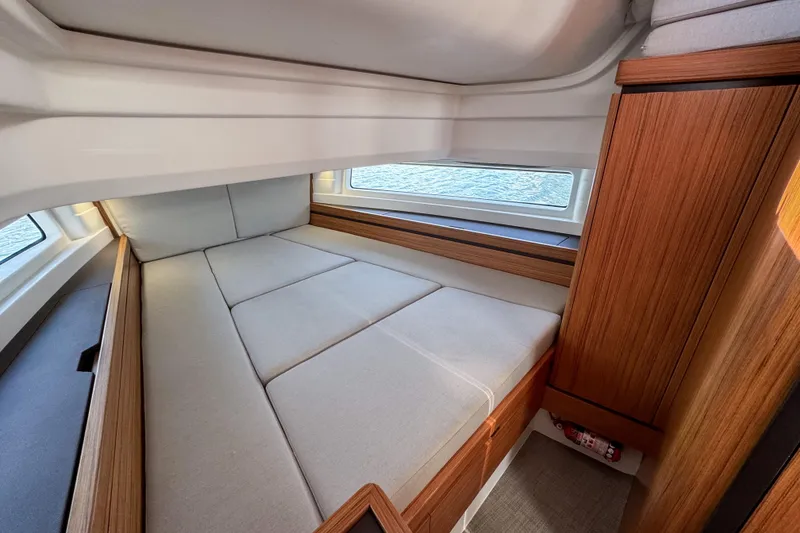 Slide: The Image of Luxurious interior of 2025 Aiata Wayfinder 38 Cabin with cozy bed and wooden accents. - 30
