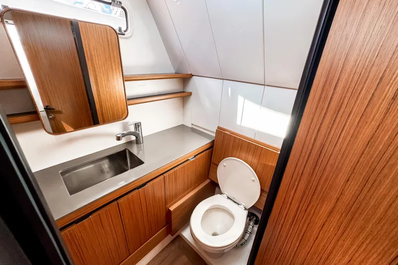 Slide: The Image of Modern bathroom in 2025 Aiata Wayfinder 38 Cabin yacht, featuring wood accents and sleek fixtures. - 31