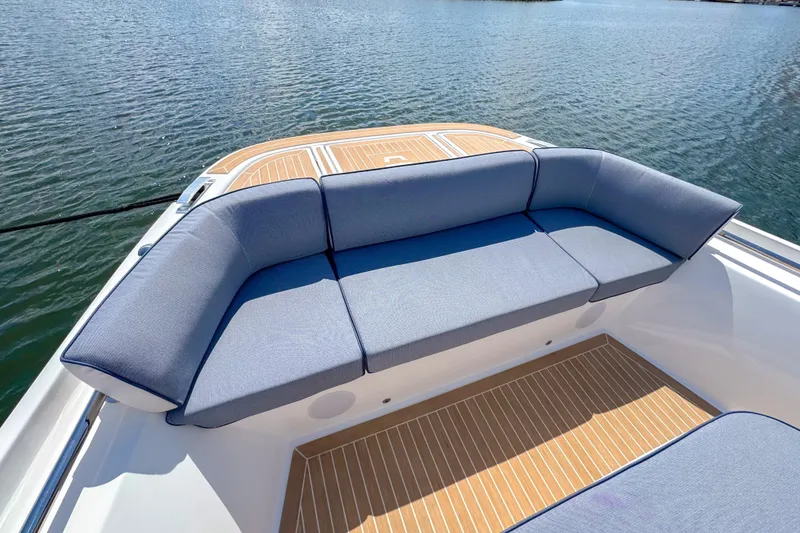 Slide: The Image of Luxurious seating on 2025 Aiata Wayfinder 38 Cabin boat, overlooking serene water. - 34