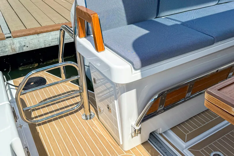 Slide: The Image of 2025 Aiata Wayfinder 38 Cabin interior with cushioned seating and wooden accents. - 36