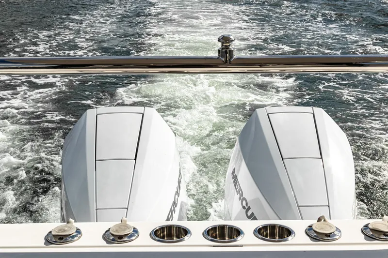 Slide: The Image of Aiata Wayfinder 38 Cabin 2026 with twin outboard motors on water. - 42