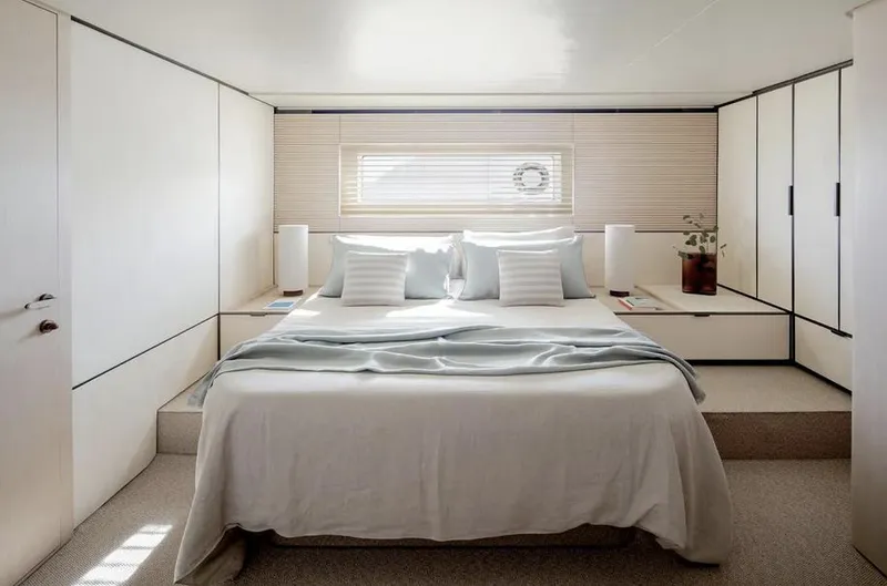 Slide: The Image of Luxurious bedroom interior of 2025 Azimut Seadeck 6 yacht, featuring modern design and elegant decor. - 13