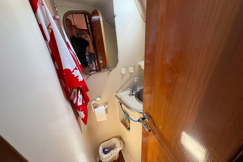 Slide: The Image of Bathroom interior of 1990 Beneteau Oceanis 500 yacht with sink and mirror. - 100