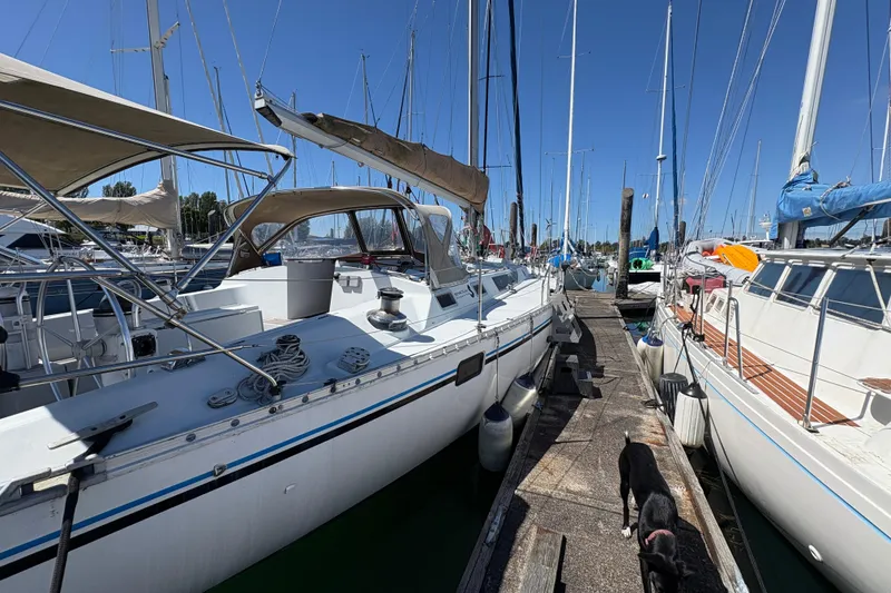 Slide: The Image of Beneteau Oceanis 500 sailboat docked at marina, 1990 model, sunny day. - 19