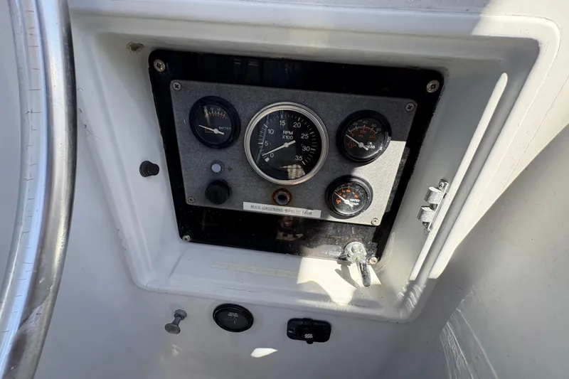 Slide: The Image of Control panel of a 1990 Beneteau Oceanis 500 sailboat with gauges and switches. - 48