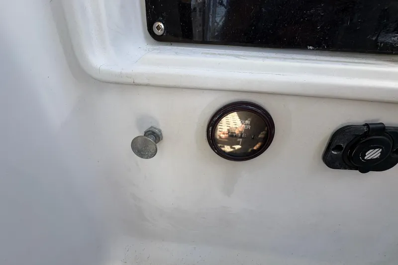 Slide: The Image of Close-up of Beneteau Oceanis 500 yacht dashboard, featuring a gauge and controls, 1990 model. - 49