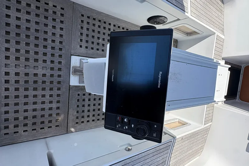 Slide: The Image of Cockpit of 1990 Beneteau Oceanis 500 with Raymarine navigation system. - 53