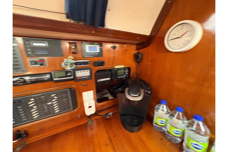 Slide: The Image of Interior of 1990 Beneteau Oceanis 500 yacht with navigation equipment and coffee maker. - 71