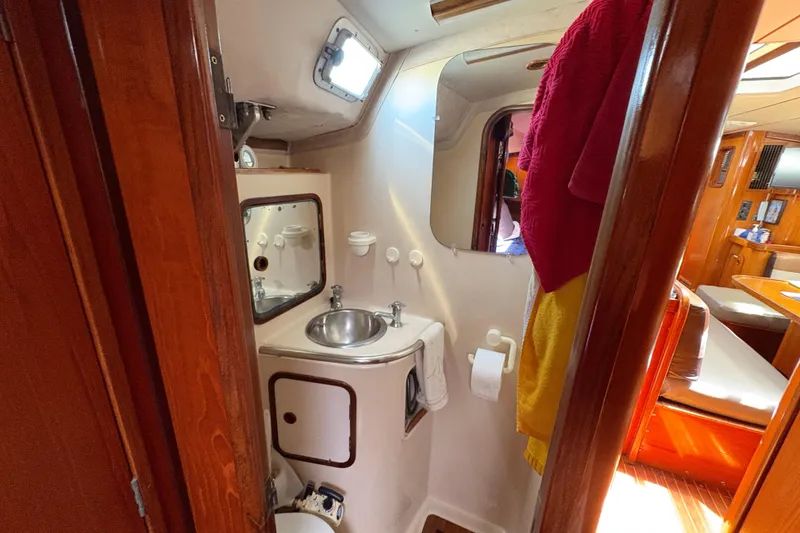Slide: The Image of Interior of 1990 Beneteau Oceanis 500 yacht bathroom with sink and mirror. - 97