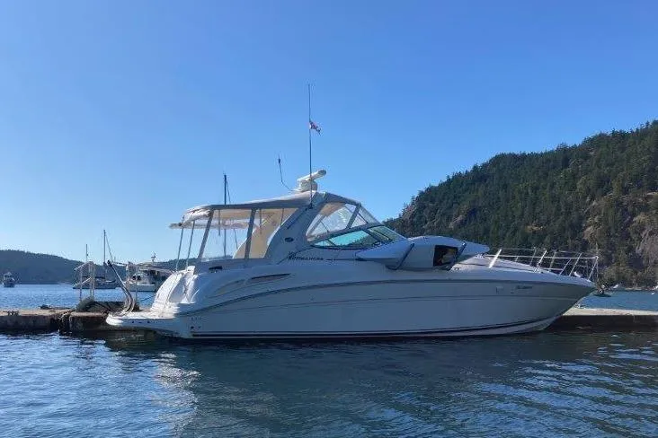 The Image of 2003 Sea Ray 360 Sundancer yacht docked in scenic marina setting. - 0