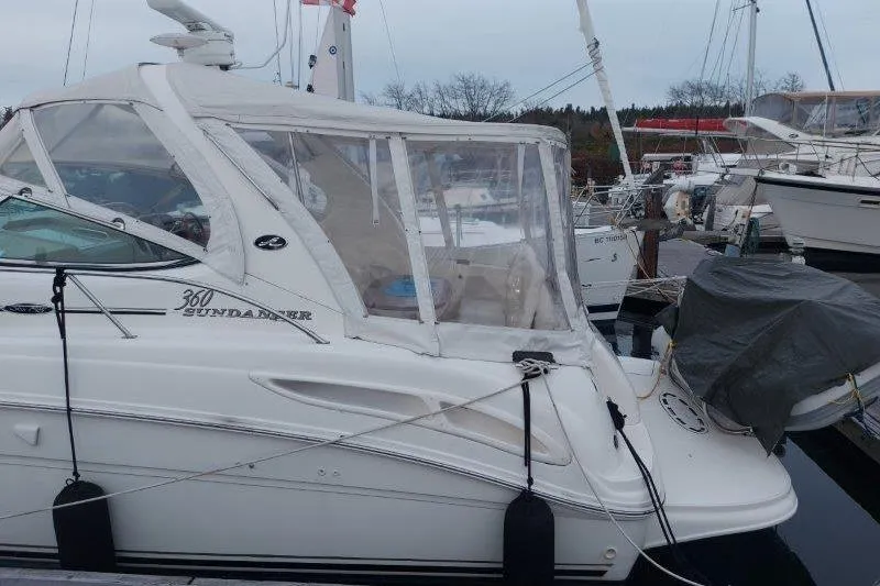 Slide: The Image of 2003 Sea Ray 360 Sundancer yacht docked at marina, side view. - 11