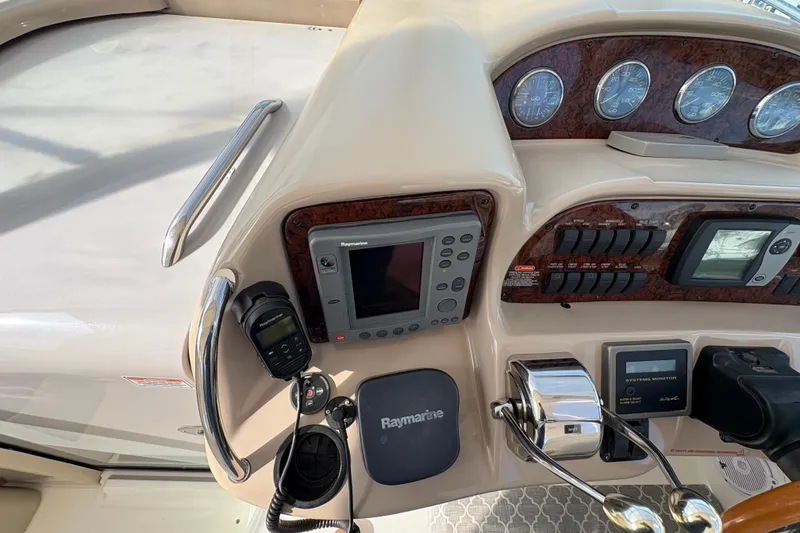 Slide: The Image of Control panel of a 2003 Sea Ray 360 Sundancer boat with navigation equipment. - 18