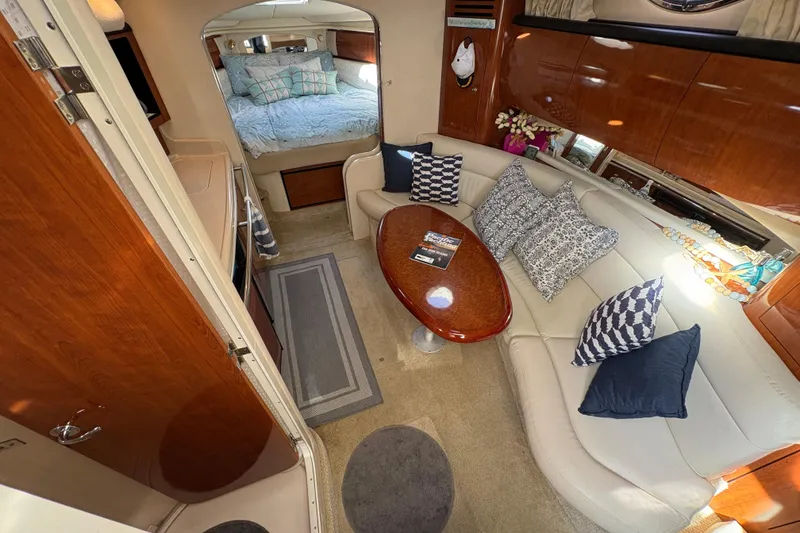 Slide: The Image of Luxurious interior of 2003 Sea Ray 360 Sundancer with elegant seating and cozy bedroom. - 23