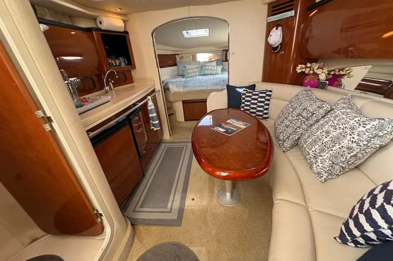 Slide: The Image of Interior of 2003 Sea Ray 360 Sundancer yacht with cozy seating and kitchenette. - 37