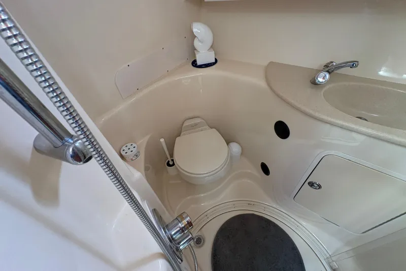 Slide: The Image of Bathroom interior of 2003 Sea Ray 360 Sundancer yacht, featuring toilet and sink. - 39