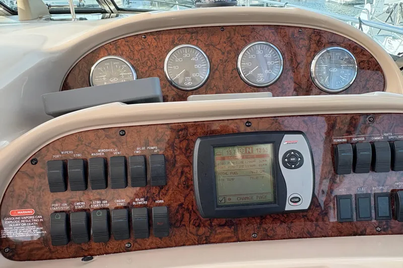 Slide: The Image of Control panel of a 2003 Sea Ray 360 Sundancer boat with gauges and switches. - 50