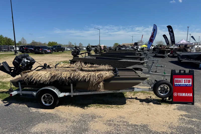 The Image of 2026 Gator Tail PREDATOR 1448 boat on trailer at outdoor sales event. - 0
