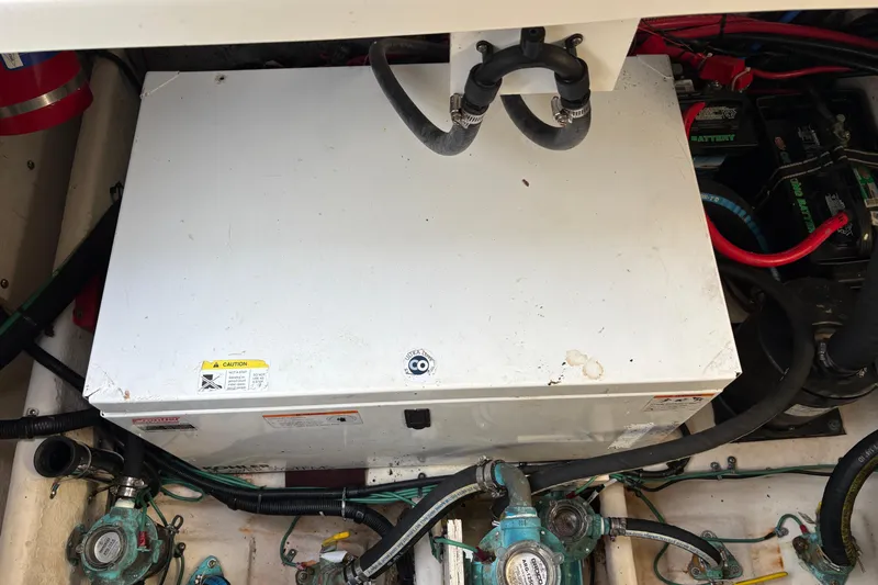 Slide: The Image of Engine compartment of 2009 Sea Ray 290 Amberjack with visible components and wiring. - 57
