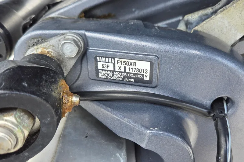 Slide: The Image of Close-up of a Yamaha F150XB engine label on a 2017 NauticStar 203DC Sport Deck. - 17