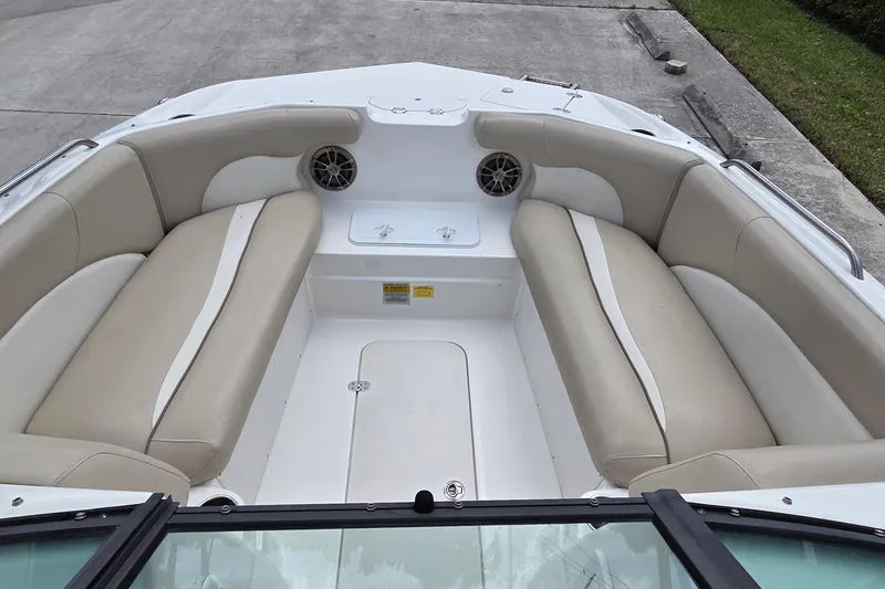 Slide: The Image of 2017 NauticStar 203DC Sport Deck boat interior with beige seating and speakers. - 3