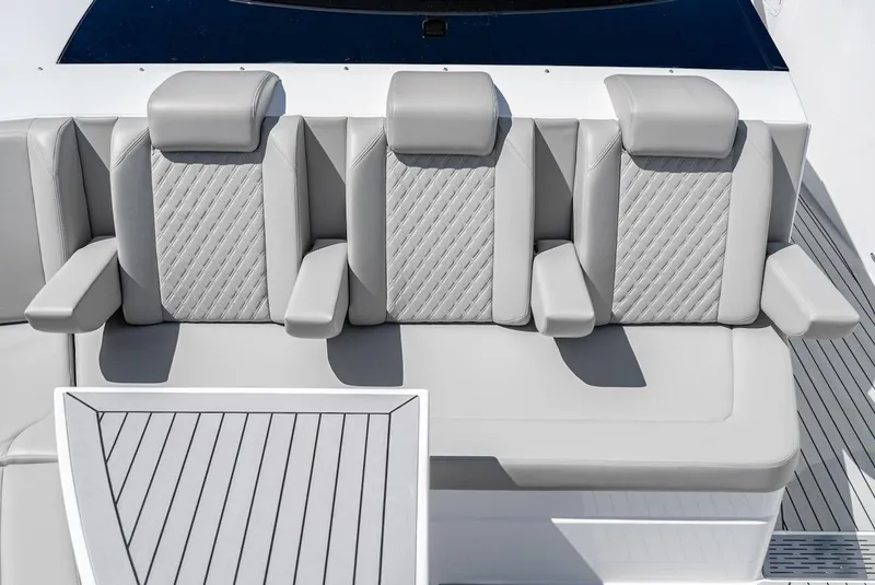 Slide: The Image of 2024 Cruisers Yachts 50 GLS, luxurious gray seating with diamond stitching. - 21