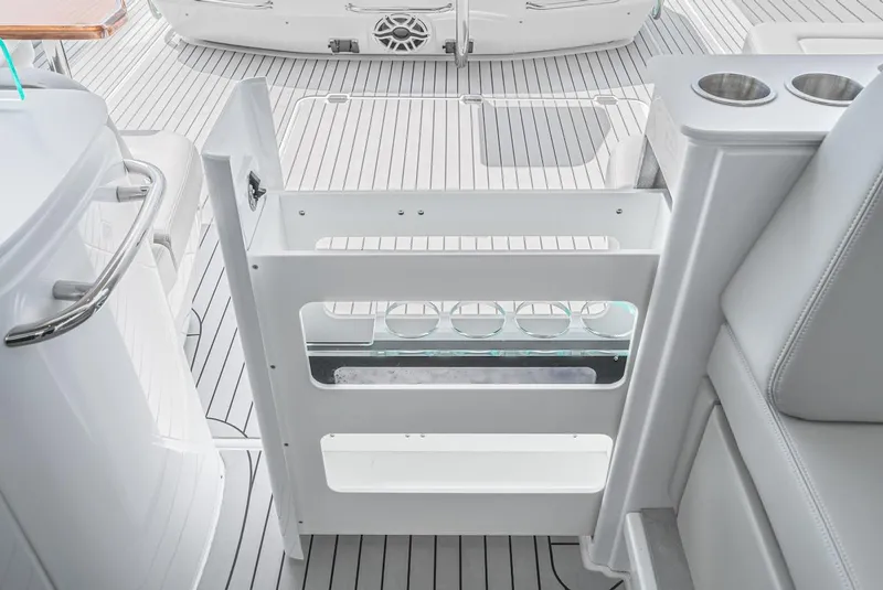 Slide: The Image of 2024 Cruisers Yachts 50 GLS deck with white gate and cup holders. - 46