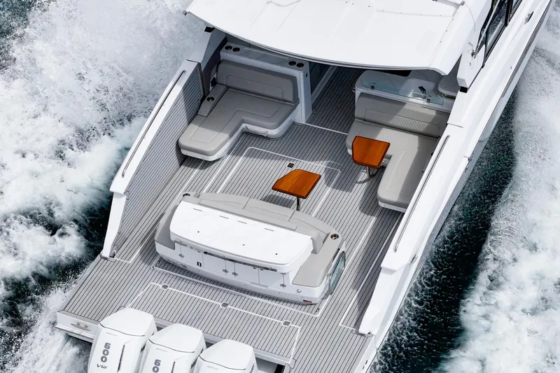 Slide: The Image of 2024 Cruisers Yachts 50 GLS luxury boat with spacious deck and seating. - 5