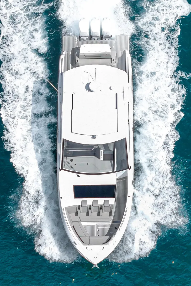Slide: The Image of 2024 Cruisers Yachts 50 GLS luxury boat cruising on blue water. - 9