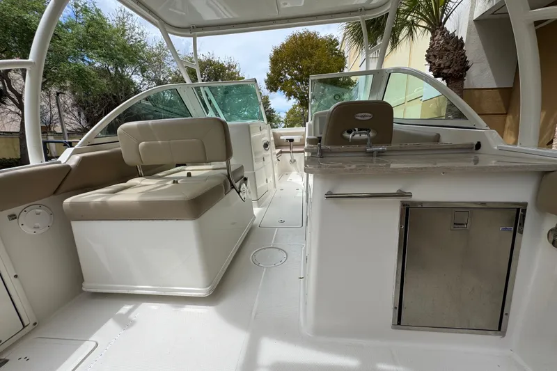 Slide: The Image of 2018 Sailfish 275 DC boat interior with seating and helm station. - 11