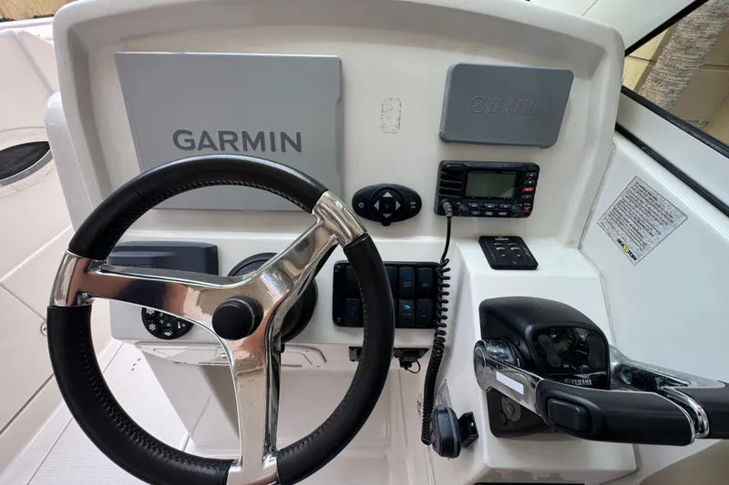 Slide: The Image of 2018 Sailfish 275 DC helm with Garmin and Yamaha controls. - 15